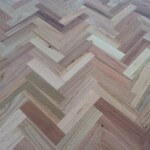 Installation and sanding and polishing of parquetry timber floor 