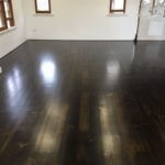 Stained wooden floors with a blend of black and walnut stain