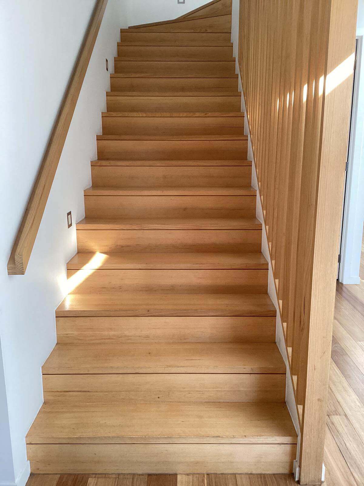 image of wooden stairs in need of cleaning and sanding because of visible wear and gunk