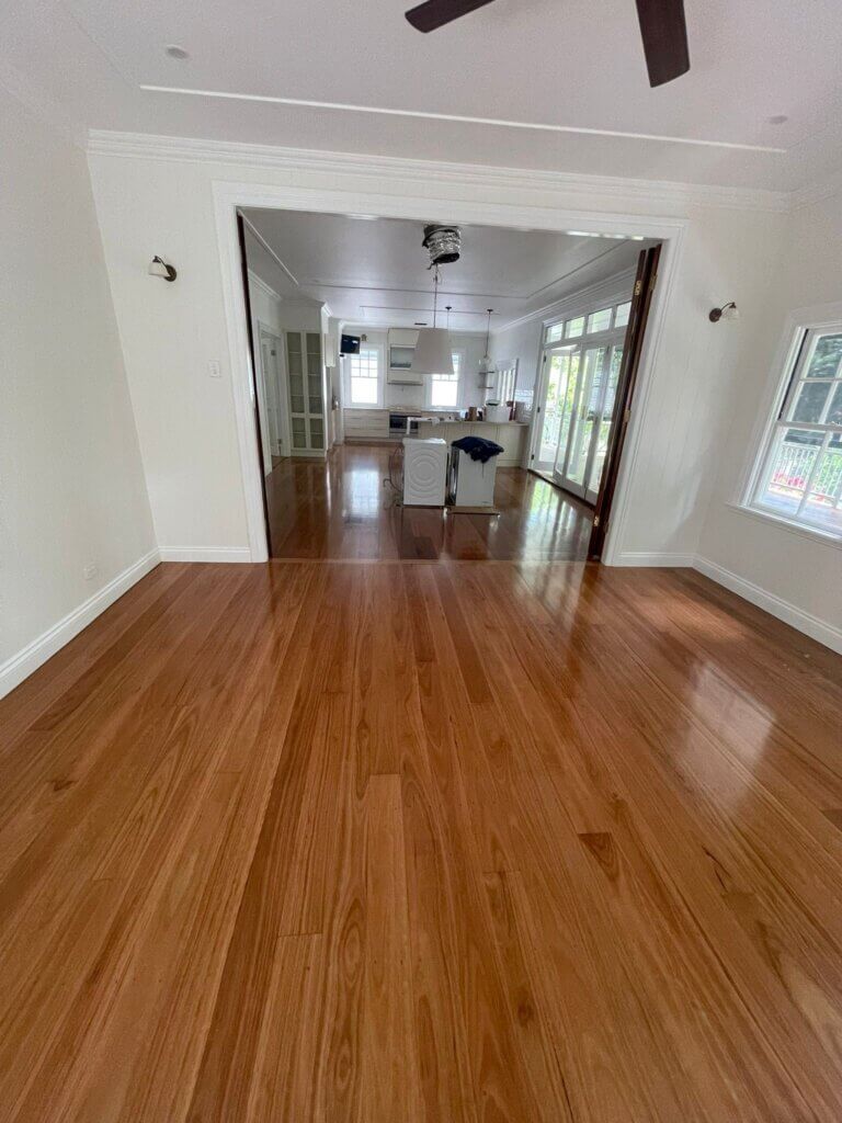 a wide timber lobby and corridor area featuring a fresh, durable urethane protective coating