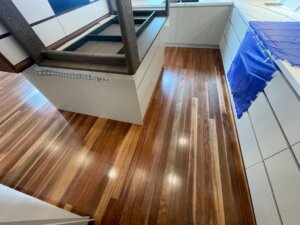 Residential kitchen timber floor sealed with a moisture-resistant polyurethane polish for high-traffic durability