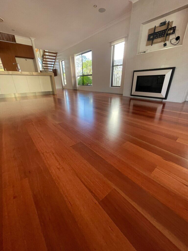 Living room hardwood floor with a clear polyurethane coating showcasing the natural wood grain after sanding