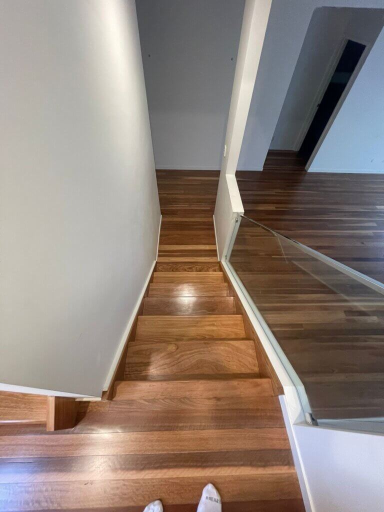 Indoor timber staircase with a protective polyurethane coating to enhance durability and wood grain